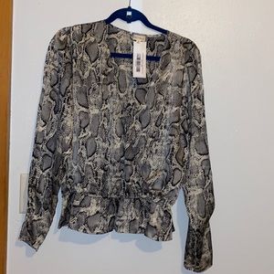 Long sleeve, snake print, peplum blouse. Purchased from a boutique, never worn.